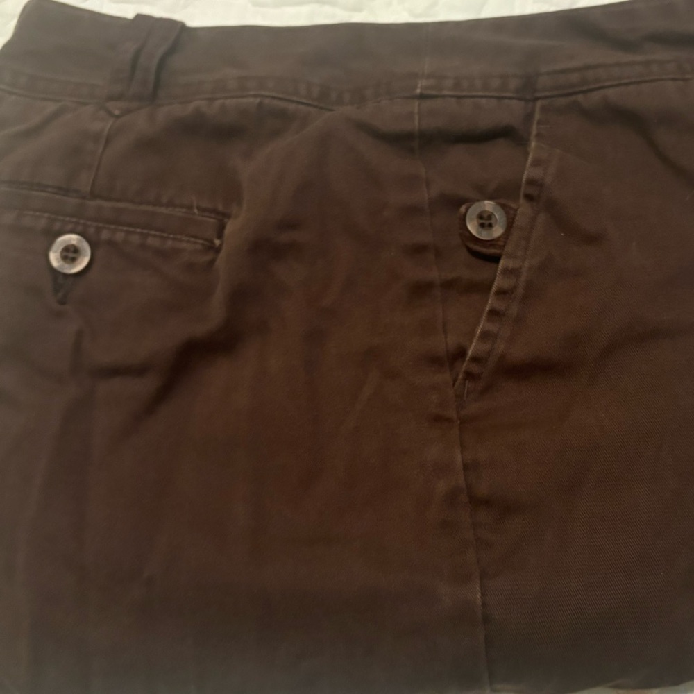 Brown straight legged pants with pockets.